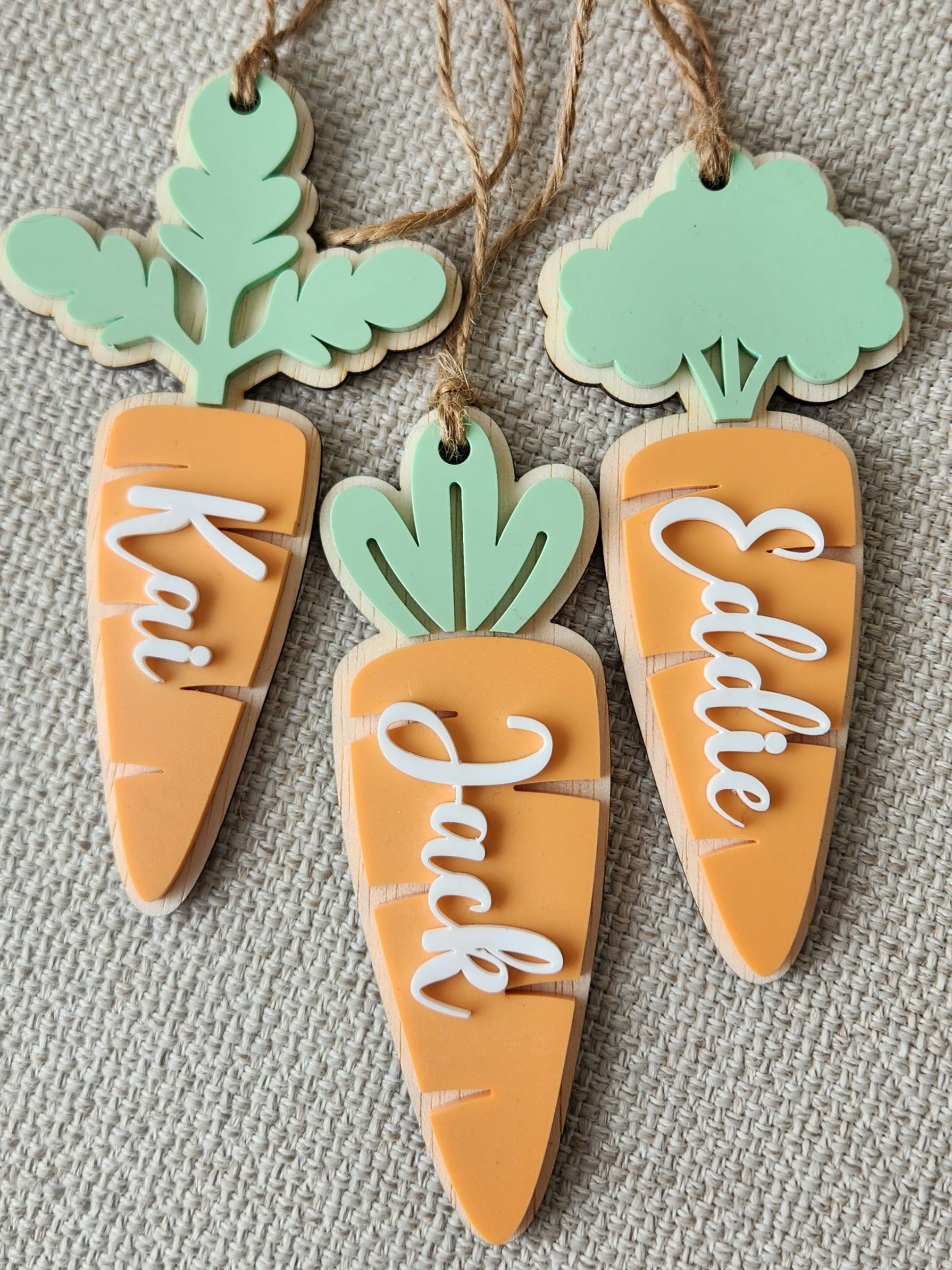 Easter name tag by Kai & I Design featuring colorful spring-themed lettering and decorative Easter motifs.